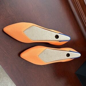 Never-worn Rothy’s point flats in lighter orange.  Size 9.